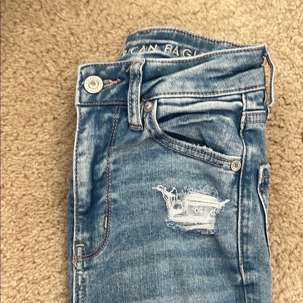 American Eagle Outfitters Blue Flared Jeans with Distressed Details
